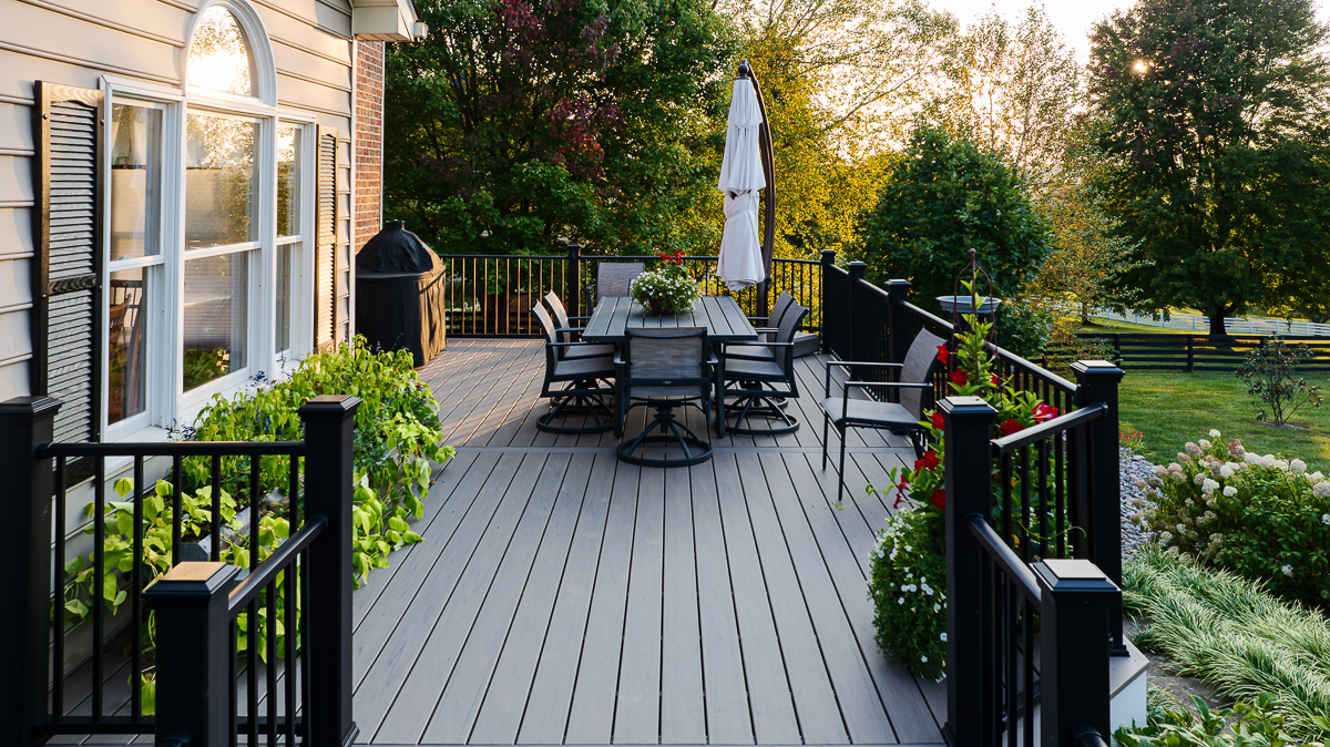 Custom-built composite deck in Fallston, MD with built-in seating and railing